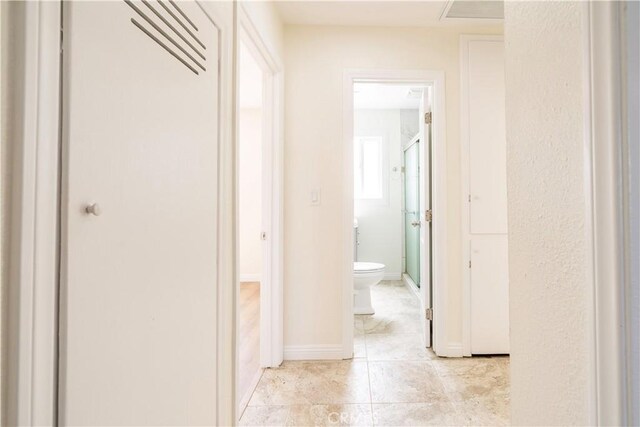 5402 N Fairvalley Ave, Covina, CA 91722 - hallway with light tile patterned flooring and baseboards