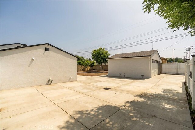 5402 N Fairvalley Ave, Covina, CA 91722 - view of patio / terrace with a detached garage and an outbuilding