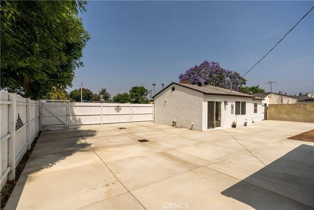 5402 N Fairvalley Ave, Covina, CA 91722 - fenced backyard featuring a gate and a patio