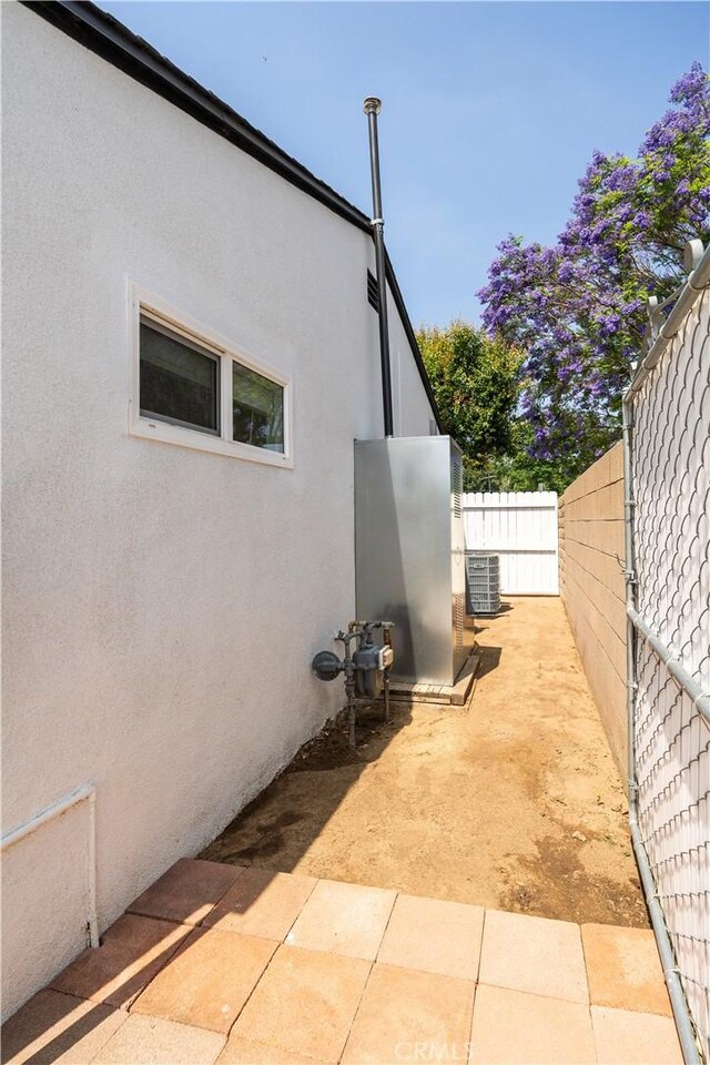 5402 N Fairvalley Ave, Covina, CA 91722 - view of home's exterior with stucco siding and a patio