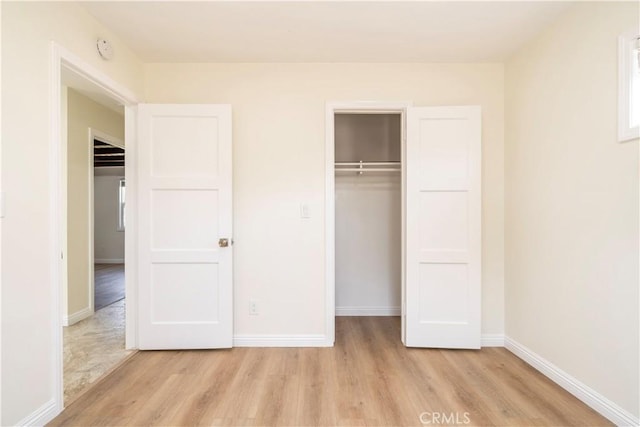 5402 N Fairvalley Ave, Covina, CA 91722 - unfurnished bedroom featuring light wood-style flooring and a closet