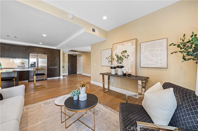 2939 Leeward Ave Unit 415, Los Angeles, CA 90005 - living area featuring light wood finished floors, recessed lighting, and baseboards