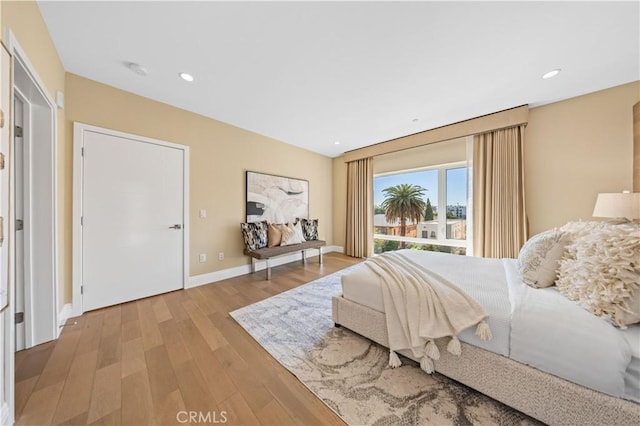 2939 Leeward Ave Unit 415, Los Angeles, CA 90005 - bedroom with wood finished floors, baseboards, and recessed lighting