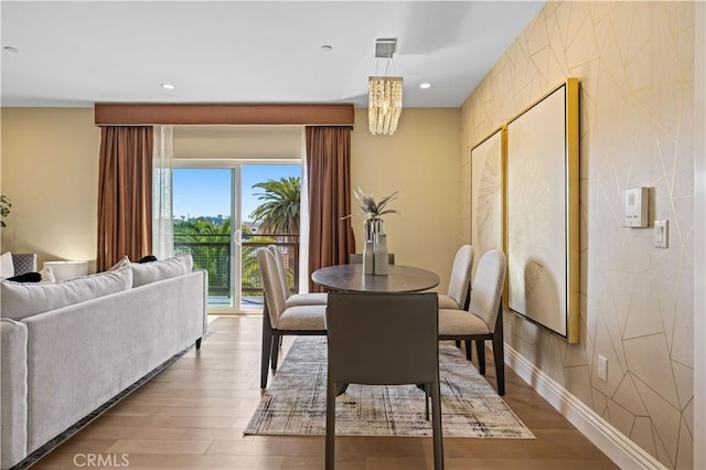 2939 Leeward Ave Unit 415, Los Angeles, CA 90005 - dining room featuring wood finished floors, recessed lighting, baseboards, and a chandelier