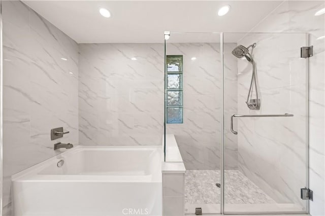 2939 Leeward Ave Unit 415, Los Angeles, CA 90005 - full bathroom with a marble finish shower, a bath, and recessed lighting