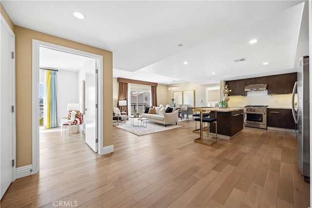 2939 Leeward Ave Unit 415, Los Angeles, CA 90005 - living room with light wood-style flooring and recessed lighting