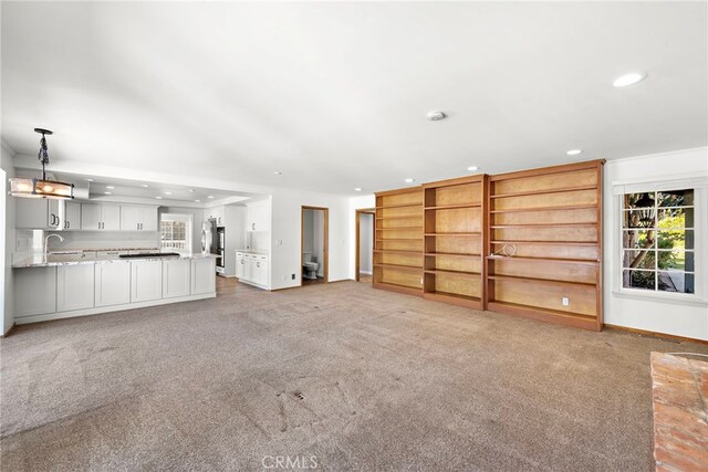 31593 Aguacate Rd, San Juan Capistrano, CA 92675 - unfurnished living room featuring recessed lighting, light carpet, and healthy amount of natural light
