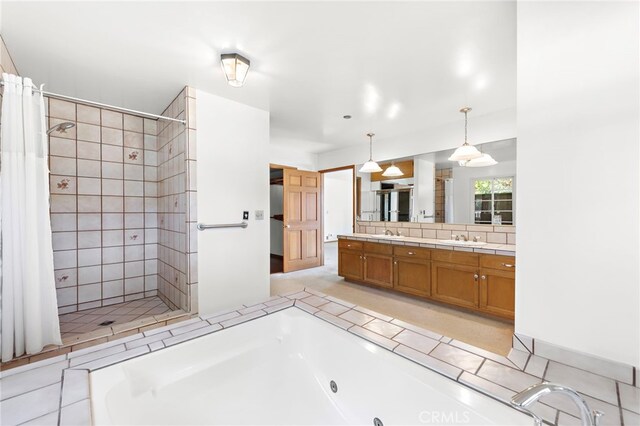 31593 Aguacate Rd, San Juan Capistrano, CA 92675 - bathroom featuring a tub with jets, vanity, and a shower stall