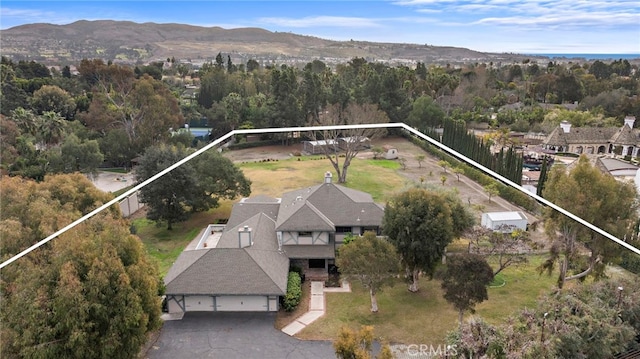 31593 Aguacate Rd, San Juan Capistrano, CA 92675 - aerial view of property and surrounding area featuring property boundaries highlighted and a mountainous background