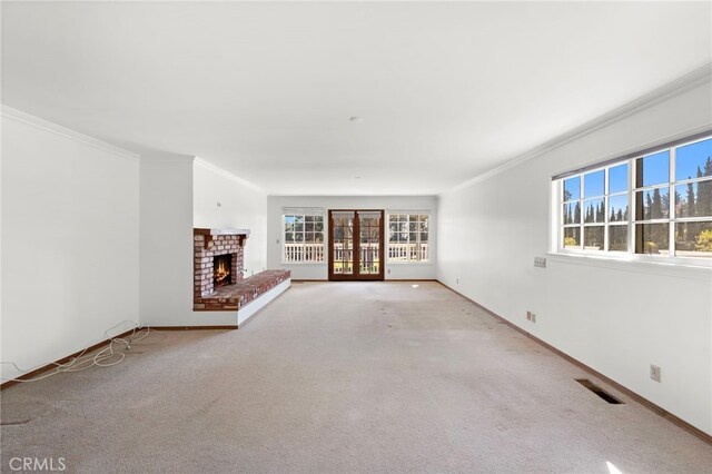 31593 Aguacate Rd, San Juan Capistrano, CA 92675 - unfurnished living room with crown molding, carpet flooring, a brick fireplace, and baseboards