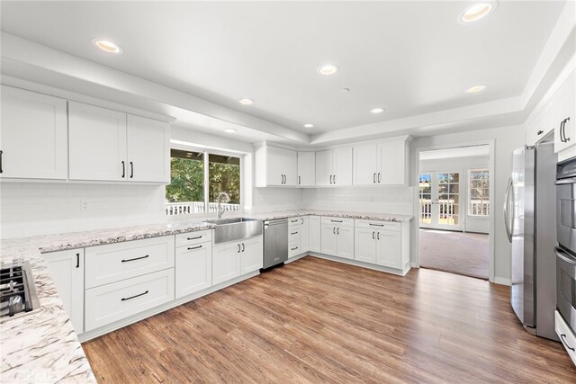 31593 Aguacate Rd, San Juan Capistrano, CA 92675 - kitchen featuring a sink, stainless steel appliances, decorative backsplash, white cabinets, and recessed lighting