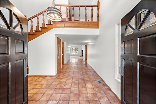 31593 Aguacate Rd, San Juan Capistrano, CA 92675 - entryway with a towering ceiling and stairway