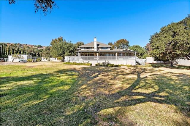 31593 Aguacate Rd, San Juan Capistrano, CA 92675 - back of property with a sunroom, a yard, stairs, and a chimney