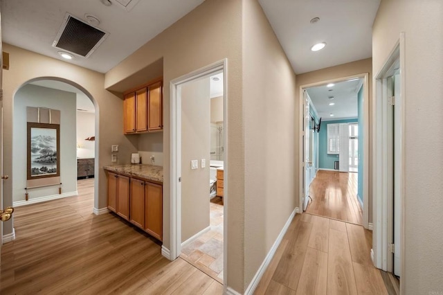 1139 Prussian, Oceanside, CA 92057 - hall with arched walkways and light wood-type flooring