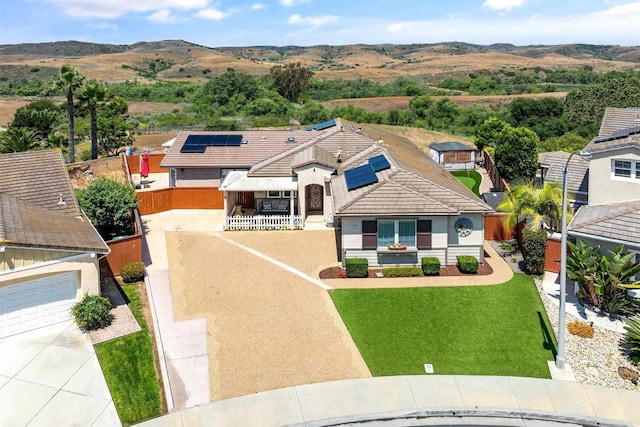 1139 Prussian, Oceanside, CA 92057 - view of front of house with roof mounted solar panels, concrete driveway, stucco siding, a tiled roof, and a garage