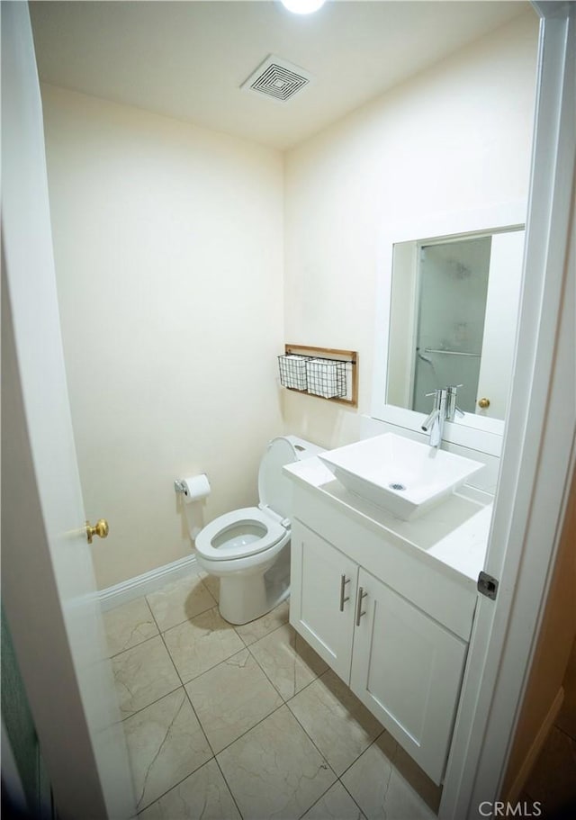 136541/2 Dronfield Ave, Sylmar, CA 91342 - bathroom with toilet, vanity, and marble look tiles