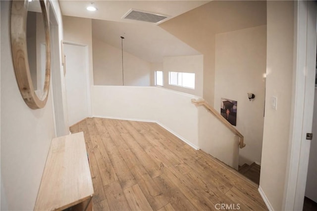136541/2 Dronfield Ave, Sylmar, CA 91342 - corridor featuring an upstairs landing, wood-type flooring, and lofted ceiling