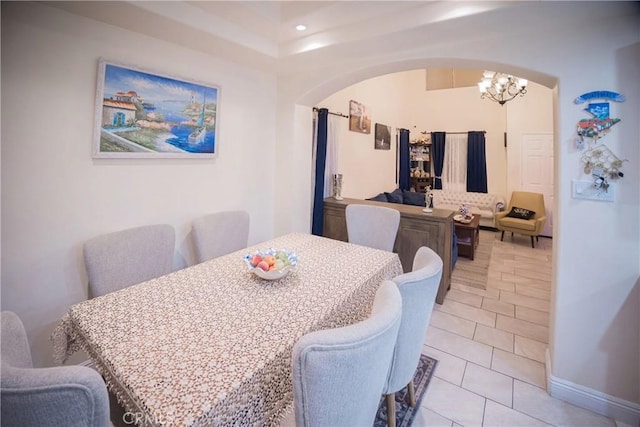 136541/2 Dronfield Ave, Sylmar, CA 91342 - dining room with arched walkways, a chandelier, light tile patterned flooring, recessed lighting, and baseboards