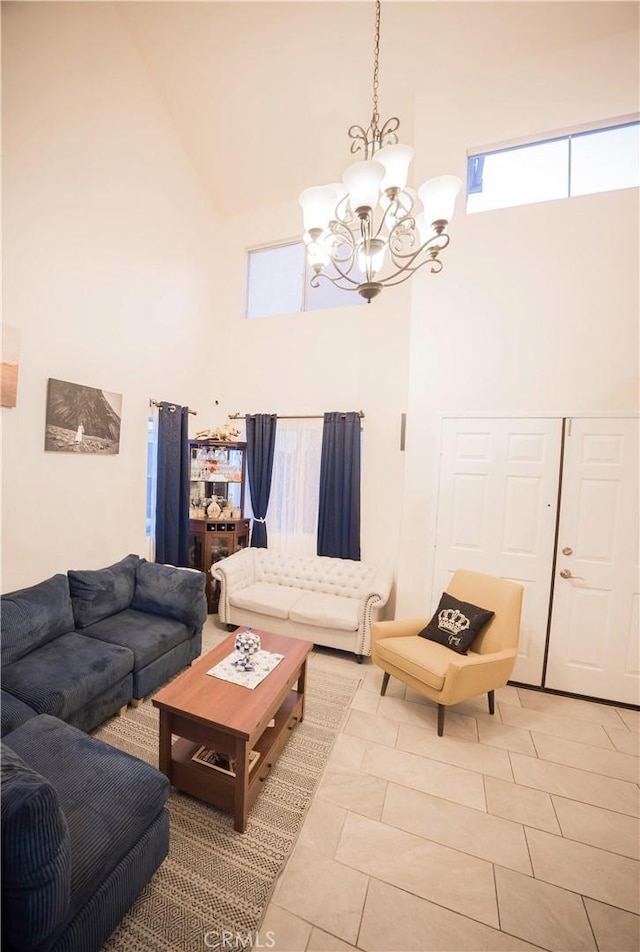 136541/2 Dronfield Ave, Sylmar, CA 91342 - living area with a towering ceiling, a chandelier, and light tile patterned flooring