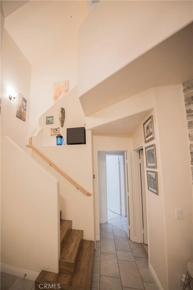 136541/2 Dronfield Ave, Sylmar, CA 91342 - hall featuring stairs, tile patterned floors, and baseboards
