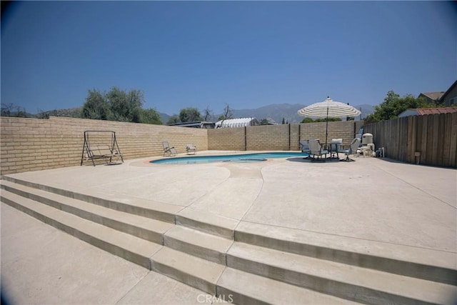136541/2 Dronfield Ave, Sylmar, CA 91342 - view of swimming pool featuring a fenced backyard, a patio, and a mountain view