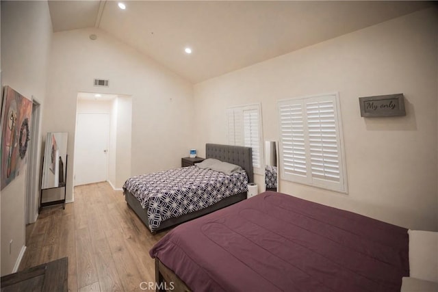136541/2 Dronfield Ave, Sylmar, CA 91342 - bedroom with wood finished floors, high vaulted ceiling, baseboards, and recessed lighting