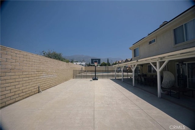 136541/2 Dronfield Ave, Sylmar, CA 91342 - fenced backyard with a mountain view and community basketball court