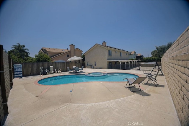 136541/2 Dronfield Ave, Sylmar, CA 91342 - view of pool featuring a pool with connected hot tub and a patio area