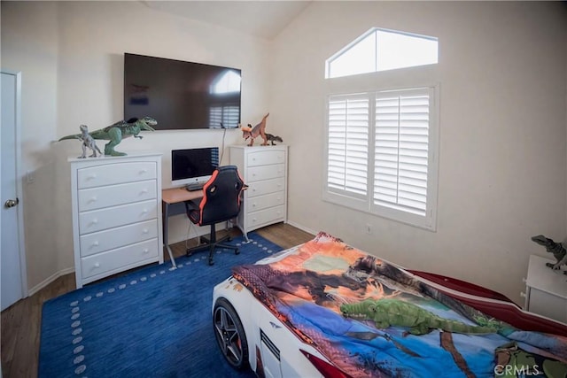 136541/2 Dronfield Ave, Sylmar, CA 91342 - bedroom featuring wood finished floors, vaulted ceiling, and a desk