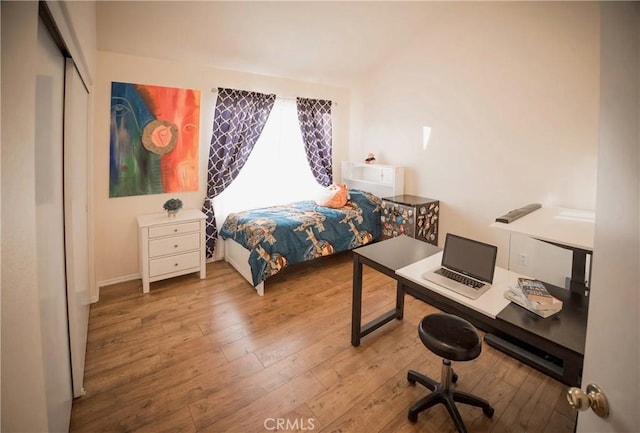 136541/2 Dronfield Ave, Sylmar, CA 91342 - bedroom with hardwood / wood-style flooring, an office area, and baseboards