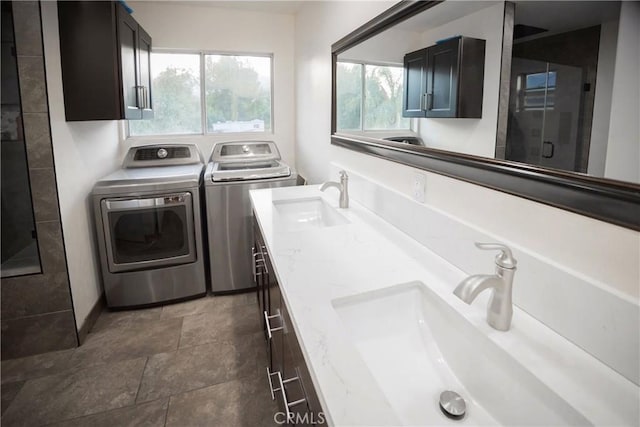 136541/2 Dronfield Ave, Sylmar, CA 91342 - washroom featuring washer and dryer and dark stone finish floors