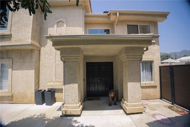 136541/2 Dronfield Ave, Sylmar, CA 91342 - property entrance featuring stucco siding, a mountain view, and a gate