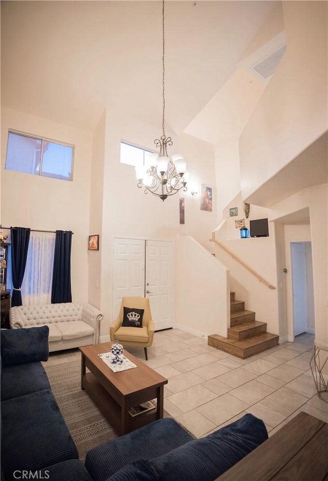 136541/2 Dronfield Ave, Sylmar, CA 91342 - living area with a towering ceiling, a chandelier, stairs, light tile patterned flooring, and baseboards