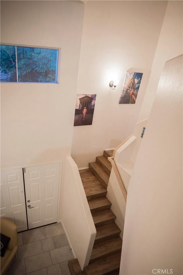 136541/2 Dronfield Ave, Sylmar, CA 91342 - staircase with tile patterned flooring and baseboards
