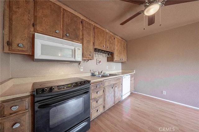 12410 Lakeview Dr, Clearlake Oaks, CA 95423 - kitchen with white appliances, a sink, ceiling fan, and light countertops
