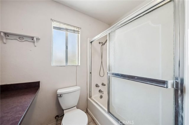 12410 Lakeview Dr, Clearlake Oaks, CA 95423 - bathroom featuring toilet and combined bath / shower with glass door