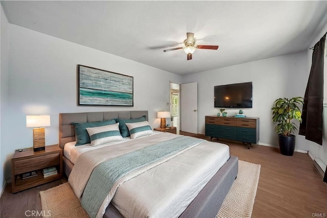 12410 Lakeview Dr, Clearlake Oaks, CA 95423 - bedroom with wood finished floors, baseboards, and ceiling fan
