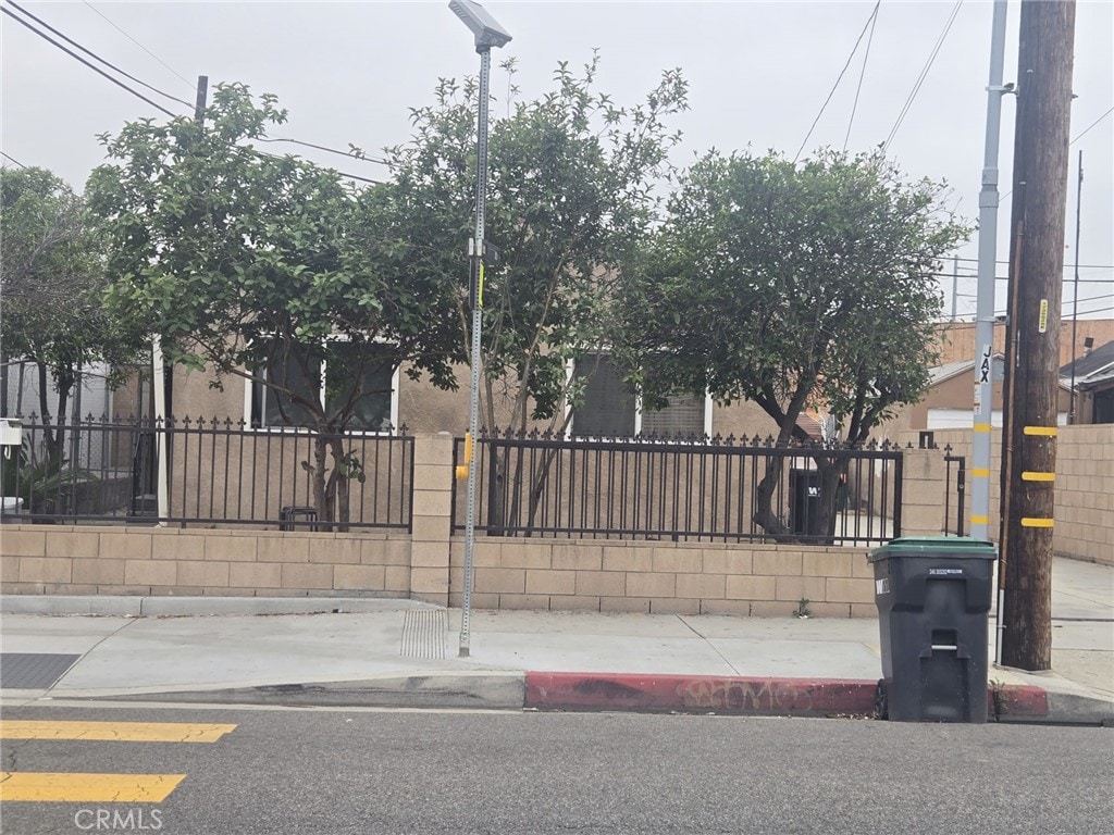 12944 Bess Ave, Baldwin Park, CA 91706 - view of front facade with a fenced front yard