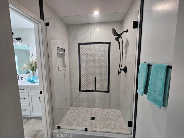 317 Pennyroyal Way, Oceanside, CA 92057 - bathroom featuring vanity, a stall shower, wood finished floors, and recessed lighting
