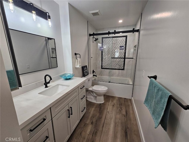 317 Pennyroyal Way, Oceanside, CA 92057 - bathroom featuring vanity, wood finished floors, and bath / shower combo with glass door