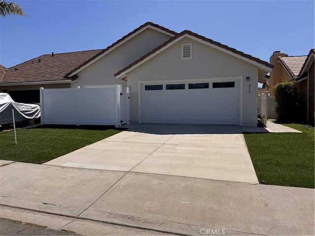 317 Pennyroyal Way, Oceanside, CA 92057 - ranch-style home with an attached garage, stucco siding, driveway, and a tiled roof
