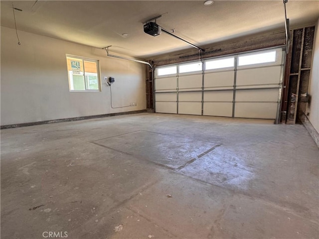 317 Pennyroyal Way, Oceanside, CA 92057 - garage with a garage door opener and baseboards