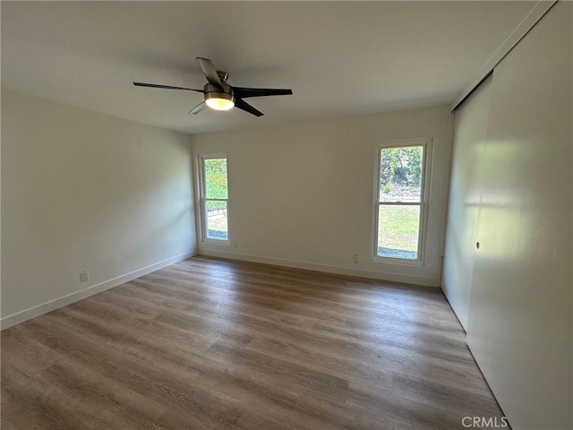 28802 El Canto Dr, Laguna Niguel, CA 92677 - empty room featuring plenty of natural light, wood finished floors, and ceiling fan
