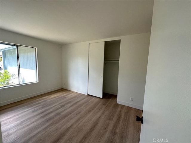 28802 El Canto Dr, Laguna Niguel, CA 92677 - unfurnished bedroom with wood finished floors and a closet