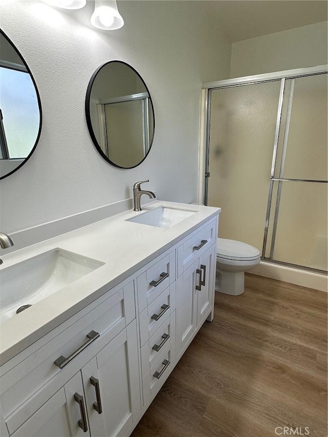 28802 El Canto Dr, Laguna Niguel, CA 92677 - full bath featuring wood finished floors, double vanity, and a stall shower
