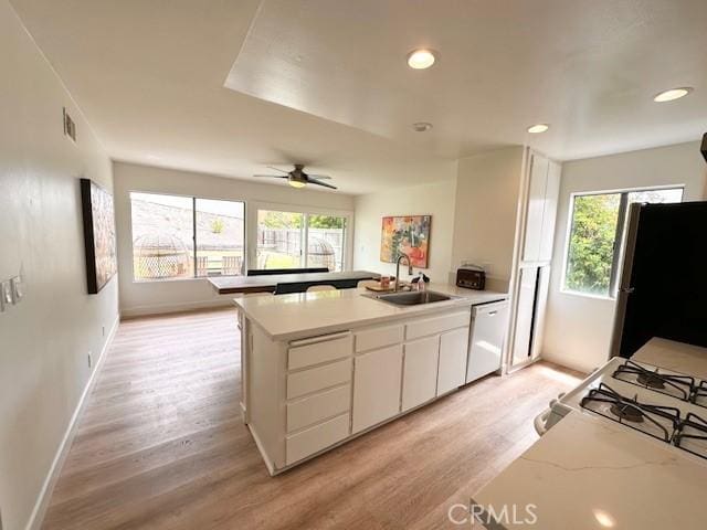 28802 El Canto Dr, Laguna Niguel, CA 92677 - kitchen featuring white appliances, a peninsula, light wood-style flooring, light countertops, and recessed lighting