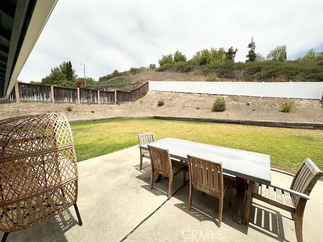 28802 El Canto Dr, Laguna Niguel, CA 92677 - fenced backyard with outdoor dining space and a patio area