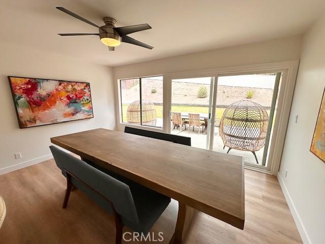 28802 El Canto Dr, Laguna Niguel, CA 92677 - dining area with light wood-style floors, plenty of natural light, and ceiling fan