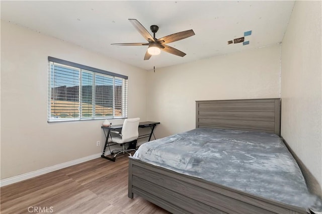 5996 Winncliff Dr, Jurupa Valley, CA 92509 - bedroom with wood finished floors, baseboards, and a ceiling fan
