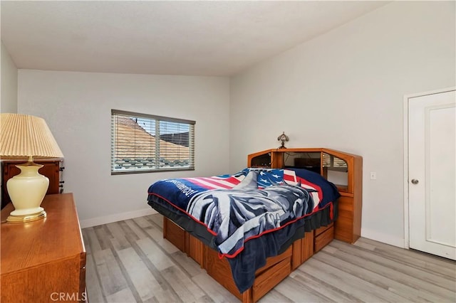 5996 Winncliff Dr, Jurupa Valley, CA 92509 - bedroom featuring light wood finished floors, lofted ceiling, and baseboards